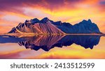 Exciting beautiful landscape with most breathtaking mountains Vestrahorn on the Stokksnes peninsula in the mirror of the lake at sunset. Exotic countries. (Meditation, antistress - concept).