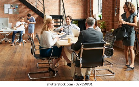 Exciting Boardroom Meeting With Business People In Trendy Office Space