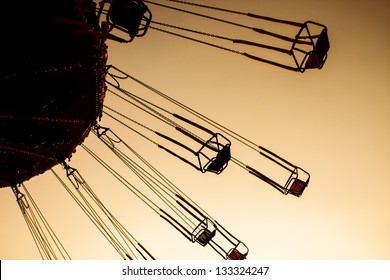 An Exciting Chair Swing Ride At A Carnival.