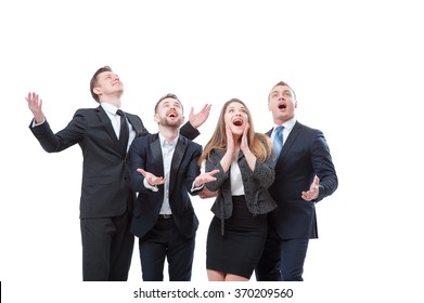 So exciting! Group of exciting businesspeople looking up and gesturing like catching something while expressing positivity. Isolated on white.