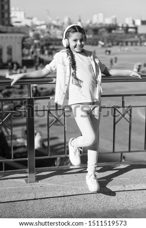 Similar – On the road in Venice. A girl stands on a bridge.