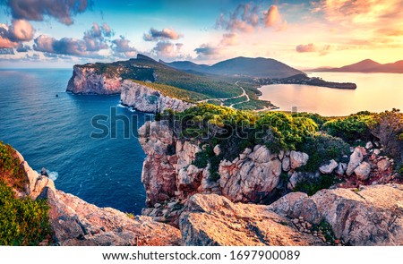 Exciting morning view of Caccia cape. Nice spring sunrise on Sardinia island, Italy, Europe. Great morning seascape of Mediterranean sea. Beauty of nature concept background.