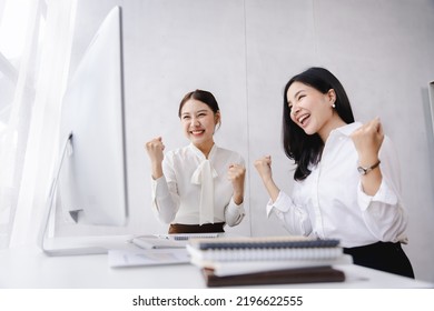 Exciting Successful Asian Businesswoman Excited To Win With A Laptop In The Office At Work.