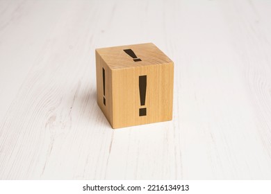 exclamation mark drawn on wooden block with copy space - Shutterstock ID 2216134913