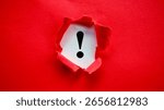 Exclamation Mark Revealed Under Torn Red Paper Showing Important Warning or Alert