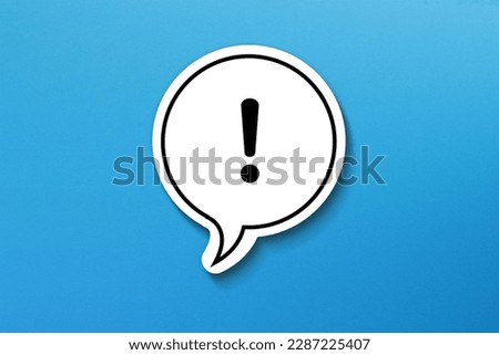 Exclamation mark with speech bubble on blue background
