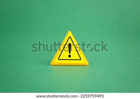 exclamation mark in yellow triangle. the concept of danger or caution