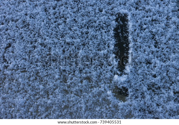 Exclamation point - drawing on snow in winter,\
pattern on winter\
glass