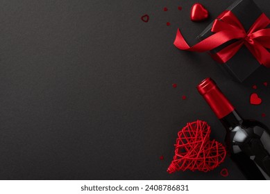 Exclusive Valentine's Elegance: top view capturing the sophistication of a sumptuous dining setup with a wine bottle, heart-shaped chocolate, a gift box, and confetti on a refined black background