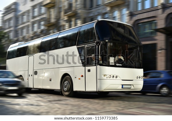 excursion bus moving on city\
street
