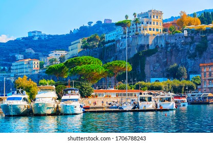 Excursion Cruise Boats And Ships With Tourists In Luxury Marina Grande Port In Sorrento Near Naples On Tyrrhenian Sea, Amalfi Coast, Italy. Italian Summer Paradise. Mountains On Amalfitana Coastline.