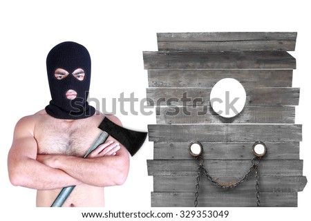 Executioner and axe with pirated shackles on a wooden wall torture isolated on white background with clipping path