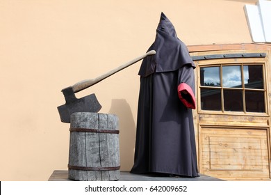 The Executioner At Block With Axe