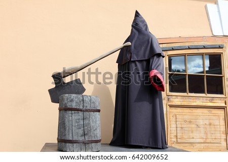 The executioner at block with axe