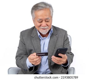 executive business asian elderly men wearing suit using mobile phone applications ,oldman payment on smartphone money transfer secure service confident lifestyle concept.