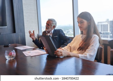 Executive business people meeting and discussing in a conference room