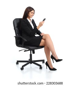 Executive Business Woman Using A Smart Phone Sitting On A Chair Isolated On A White Background