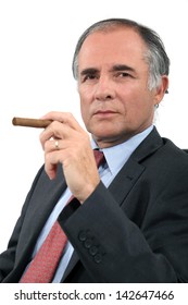 Executive with a cigar - Shutterstock ID 142647466