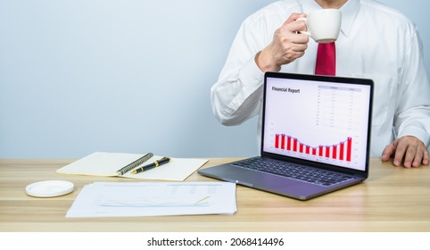 executive drinking coffee while present financial report graph on laptop with white copy space background for making meeting presentation, professional businessman busy work on the business data graph