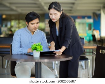 Executive Female Manager Training Her New Staff, Coaching A New Employee In Marketing Team At The Office.