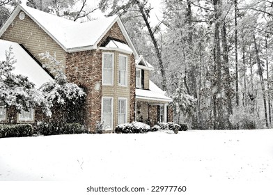 Executive Home Covered With A White Snow Blanket On A Cold Winter Day.