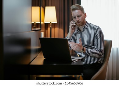 Executive Manager At The Office With His Laptop. Businessman Working On His Computer At A Hotel Room. Guy Typing On His Laptop.