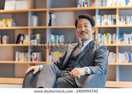 Executive middle-aged man talking in the lobby