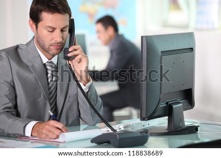 executive on the phone in ffice