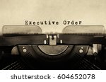 Executive order words typed on vintage typewriter.