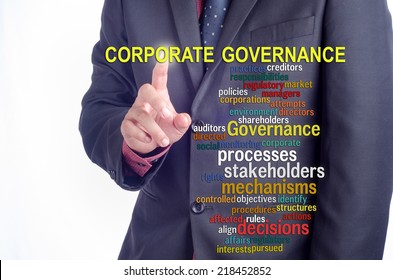 Executive pressing the touch screen: "CORPORATE GOVERNANCE" word cloud arrangement