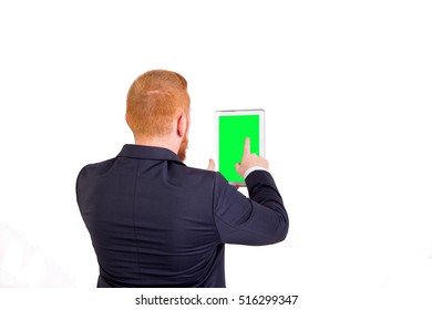Executive redhead with tablet