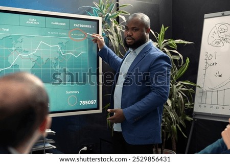 Executive team attend an information sharing meeting to verify details on regulatory changes or industry standards. Enterprise analysts and consultants reviewing data statistics.
