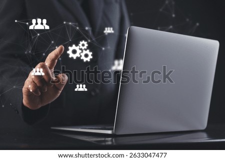Executive uses advanced digital tools on virtual screen to illustrate goal focused leadership, operational efficiency and the role of smart systems in shaping organizational success