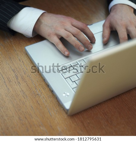 Executive using laptop. Conceptual image shot