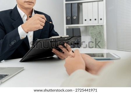 Executives accept job application documents and read job applicants resume to match the position. company publishes vacancies online to find human. Human resource, interview, letters, competence. 