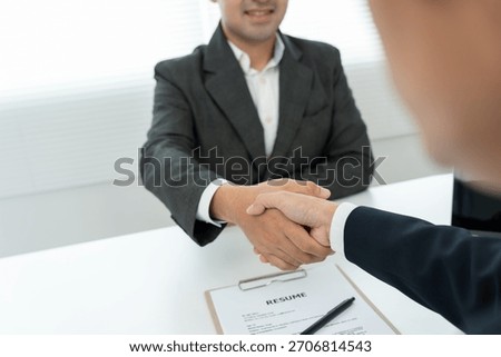 Executives accept job application and shake hand, documents and job applicants resume to match the position. company publishes vacancies online to find human. Human resource, interview, letters.