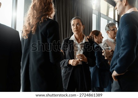 Executives connecting during discussion at event in a modern hotel lounge,symbolizing innovation,partnership,business connection,empathy,negotiation and the importance of professional relationships.