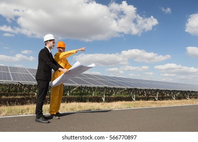 Executives talk to engineers about the solar power project.