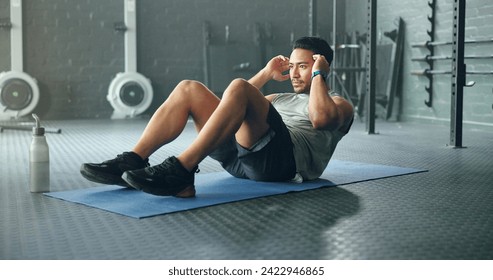 Exercise abdomen training, man and fitness body workout in gym. Young Asian person athlete, healthy sports wellness goal and core muscle power crossfit motivation on yoga mat in health studio - Powered by Shutterstock