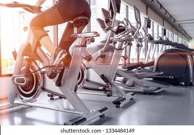 Exercise Bike Cardio Workout At Fitness Gym Of Woman Taking Weight Loss With Machine Aerobic For Slim And Firm Healthy In The Morning.