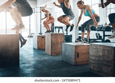 Exercise, class and people with jumping in group for fitness, workout and training for power challenge. Sports, crowd or performance in gym club for health, strong legs or athlete on box for wellness - Powered by Shutterstock