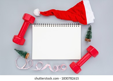 Exercise, Fitness and Working Out Merry Christmas and Happy new year concept. Sports equipment on gray background with copy space. Flat lay, Top view, overhead, mockup