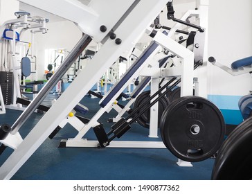 Exercise Machines In Classic Small Gym, White Interior, As A Background. Fitness Club, Sport, Wellness, Activity, Lift Weights, Work Out And Power Concept