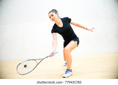 Exercise on the righthand in squash, girl athlete