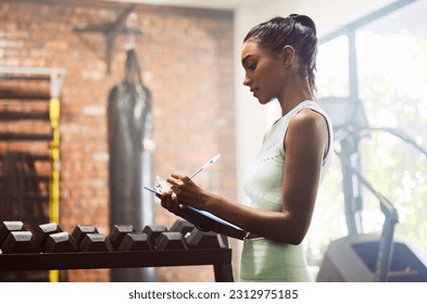 Exercise, personal trainer and woman in a gym, inventory and checklist for equipment, schedule and hygiene inspection. Female person, entrepreneur or athlete with documents, feedback and training - Powered by Shutterstock