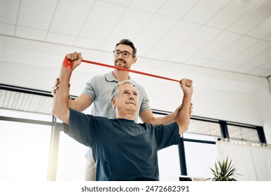 Exercise, physiotherapist and old man with resistance band, stretching and senior care rehabilitation. Physio, caregiver and elderly patient for mobility training, healthcare and help in retirement. - Powered by Shutterstock