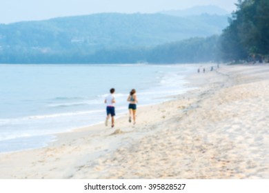 Exercise runner on the beach. Blur photo