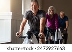 Exercise, spinning class and mature people in gym for cycling, fitness and training with physical activity. Workout club, men and woman on bicycle for health, wellness and endurance with cardio
