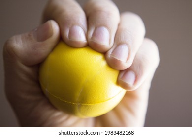 Exercises With One Hand And Yellow Physiotherapy Ball