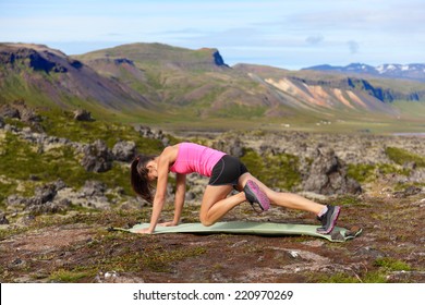 Exercising Fitness Woman Doing Exercises In Nature. Girl Doing Mountain Climbers Exercise Training Outside In Amazing Landscape On Iceland. Fit Female Asian Caucasian Athlete Sport Model .